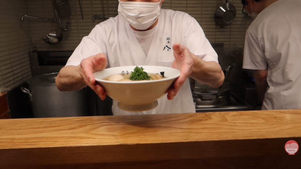 Professional ramen preparation at Ginza Hachigo
