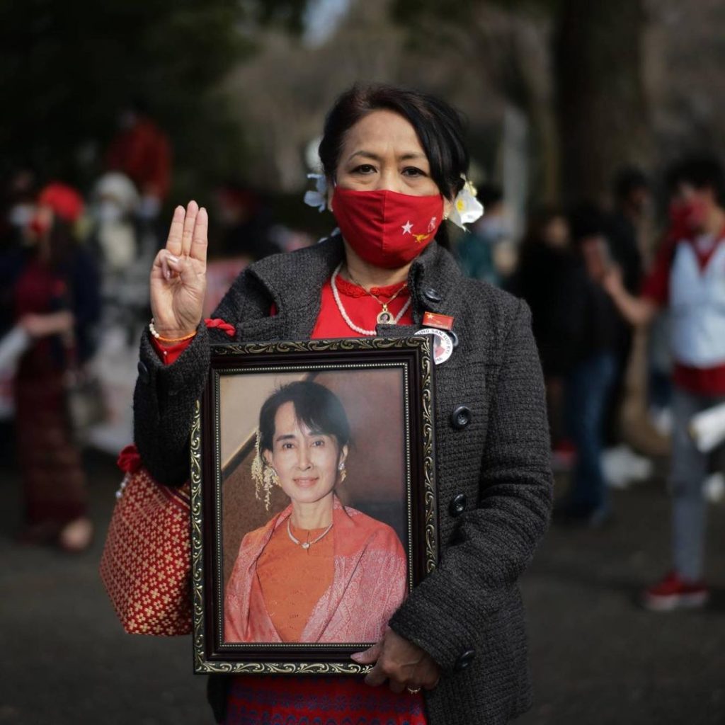 The flag of Myanmar was hoisted high Sunday in Tokyo’s Shibuya Ward, where thous...