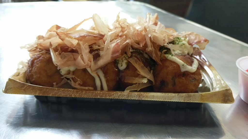 Katsuobushi dancing on fresh takoyaki
