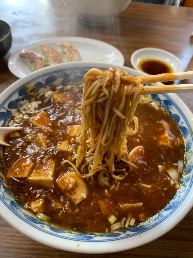 This is Maporamen. I think miso-based soup for the ramen and topped with thick mabodofu. A bit spicy, perfect for cold weather!