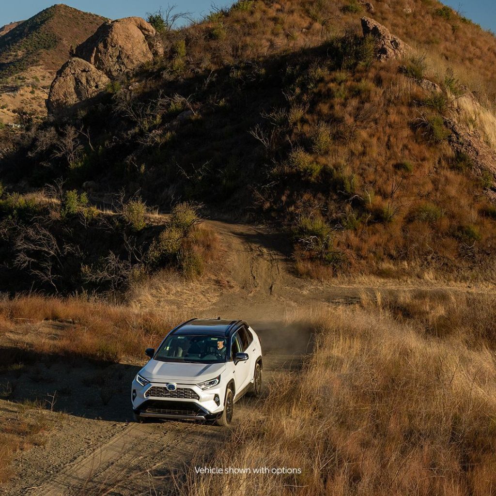 Loves the city. Lives for the outdoors. #RAV4 Hybrid #LetsGoPlaces...