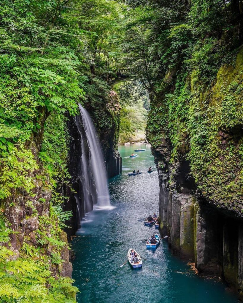 Takachiho Gorge’s lush greenery, towering cliff faces, and cascading waterfalls,...