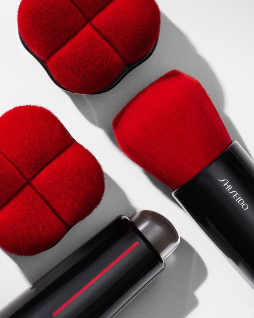 Discover our iconic red-fiber brushes, inspired by ancient beauty rituals and ha...