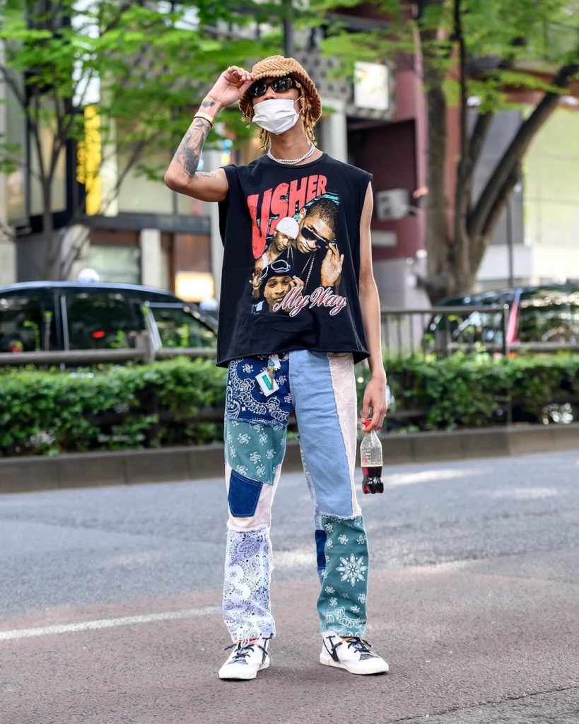 Hanatarou (@durrrk9) on the street in Harajuku wearing an Usher "My Way" sleevel...