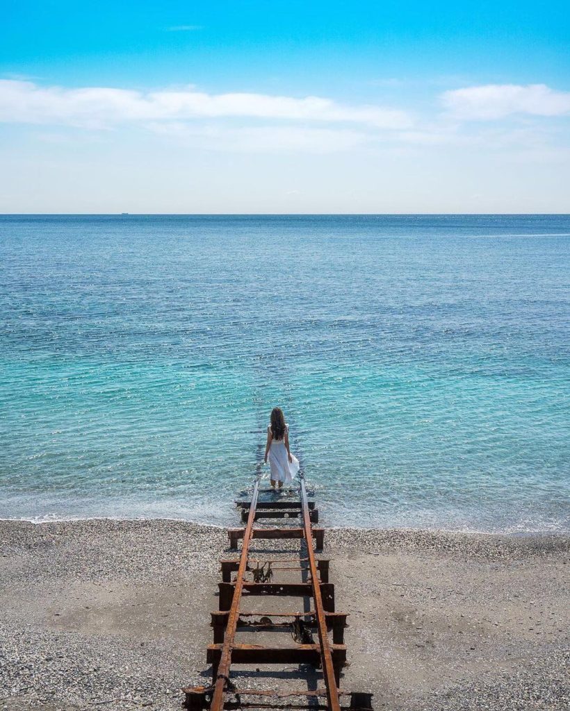 On Kurogahama Beach in Oita Prefecture, a defunct railroad track leads into the ...