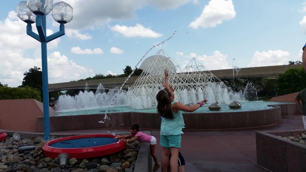 trying to catch Jumping Water at Disney's Imagination Fountains