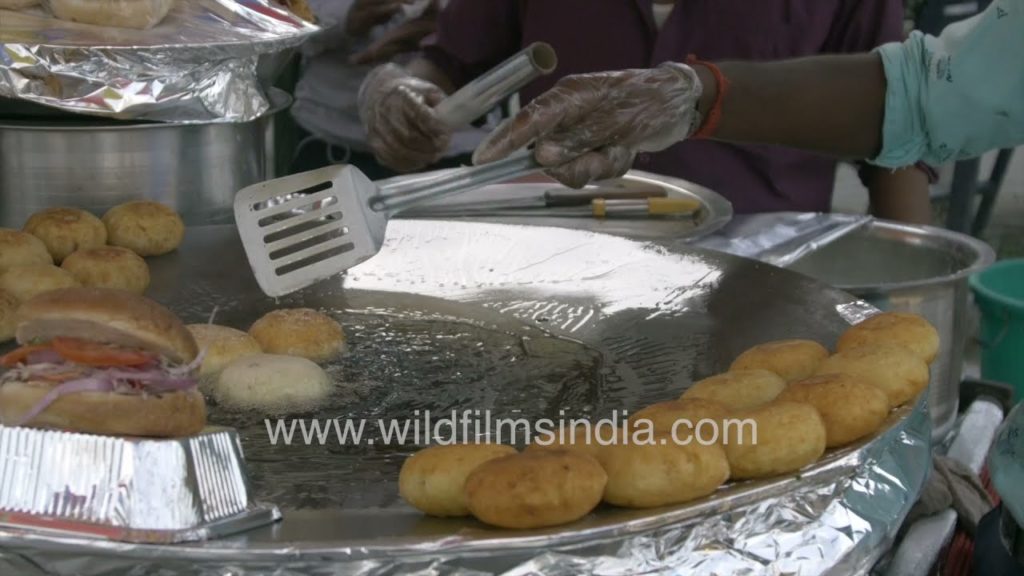 Stuffed Kachori being deep fried on Yusuf Sarai road: Street Food of New Delhi Stuffed Kachori being deep fried on Yusuf Sarai road: Street Food of New Delhi