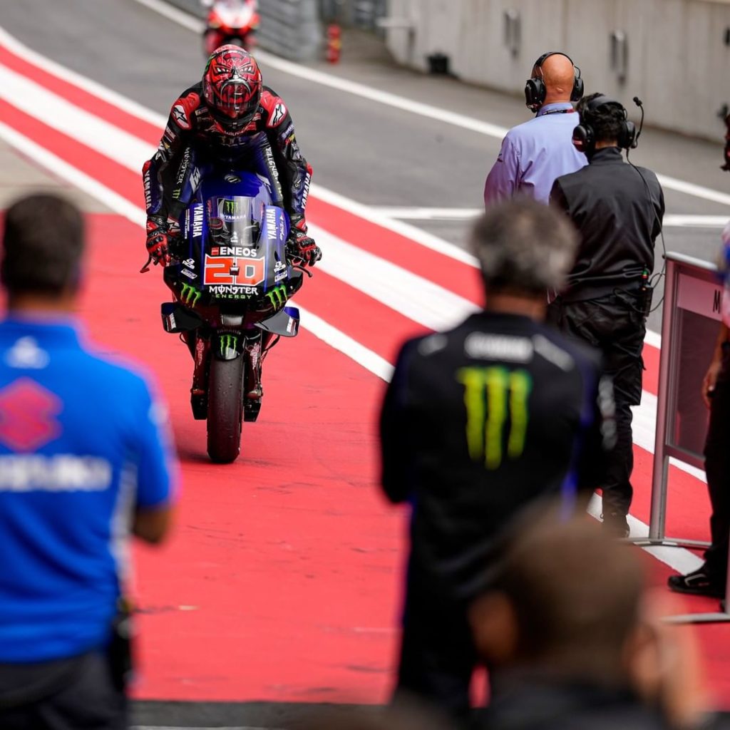 @fabioquartararo20 celebrates today's 3rd place with a stoppie and a big smile i...