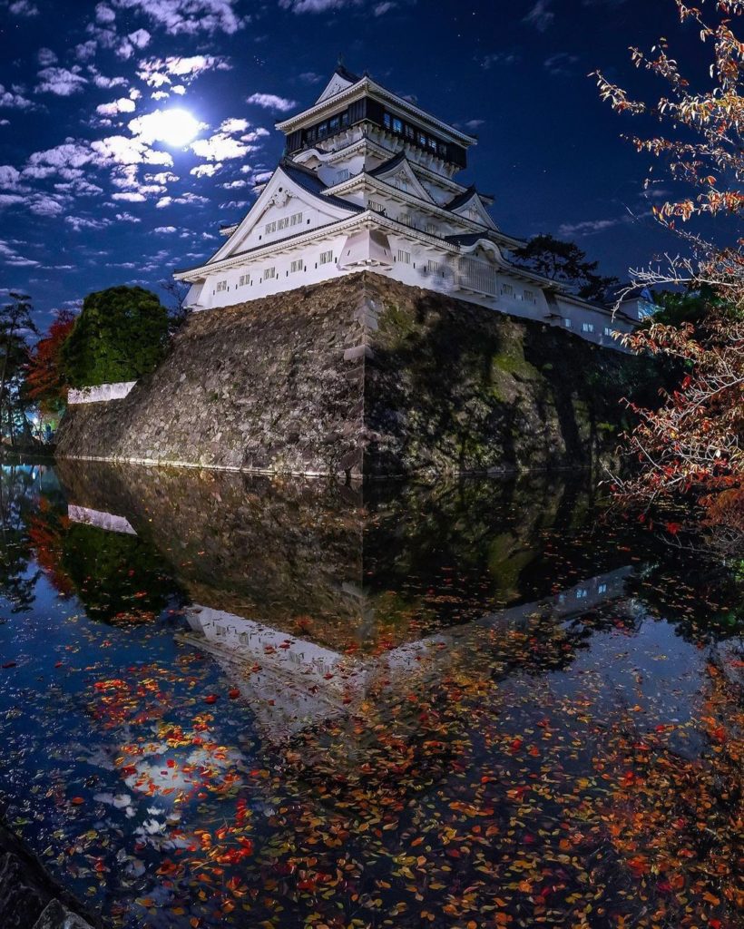 What can you see in the reflection on a beautiful night?
A moat full of red leav...