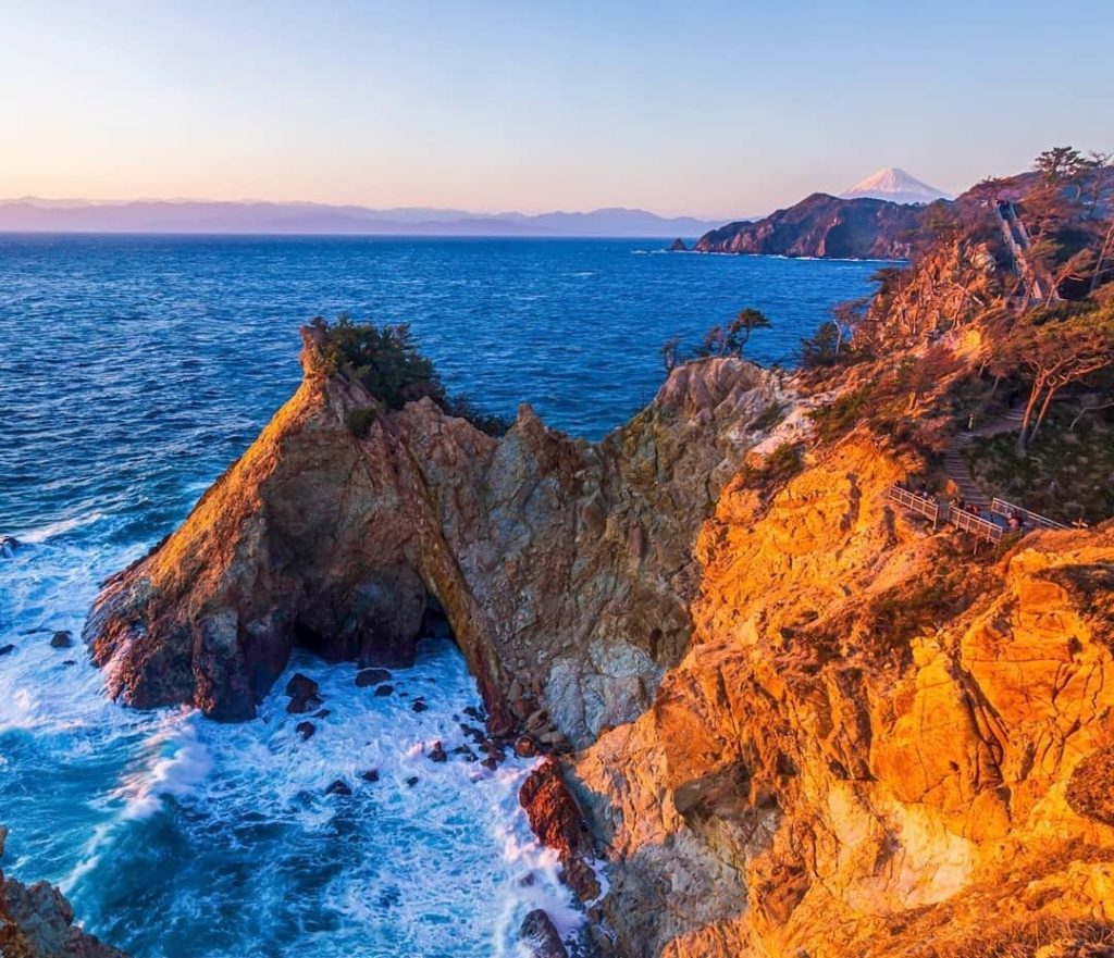 Visit Japan: Wouldn’t you be mesmerized by the contrast of the blue ocean and golden rockface… Wouldn't you be mesmerized by the contrast of the blue ocean and golden rockface...