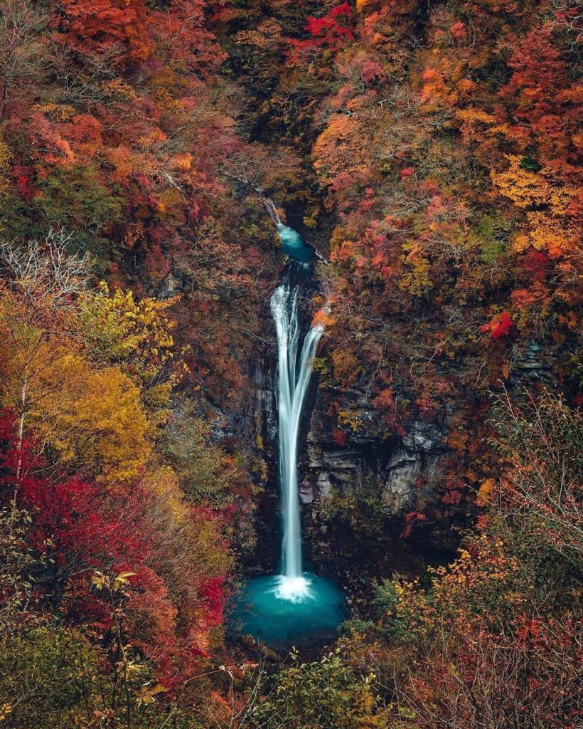 Komadomeno Falls is a 65-foot high waterfall that flows into a beautiful blue po...