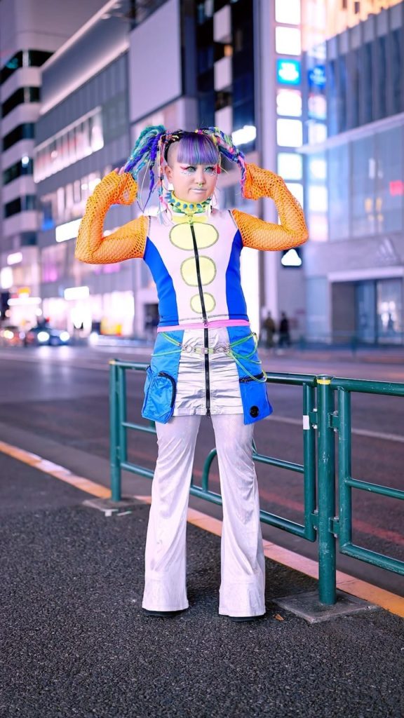 Japanese songwriter @Miyu__0829 wearing cyber fashion on the street in Harajuku....