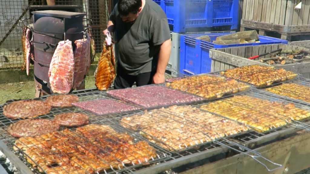 Italy Street Food. Ribs Roasted on Stove, Mixed Meat on Grill, German Strudel, Burgers and more Food