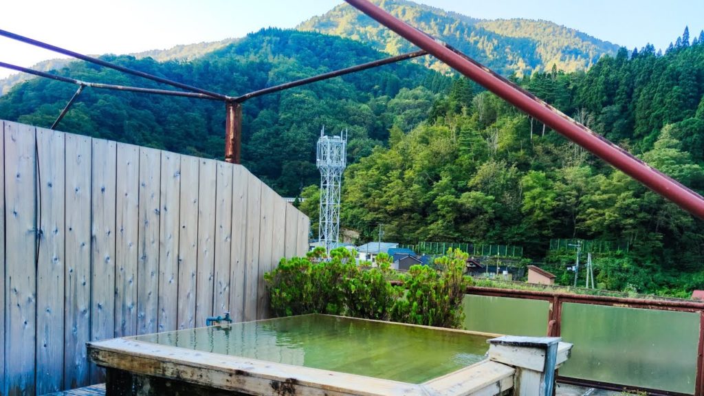 Rooftop hotsprings morning views - Japanese onsen in Niigata Prefecture