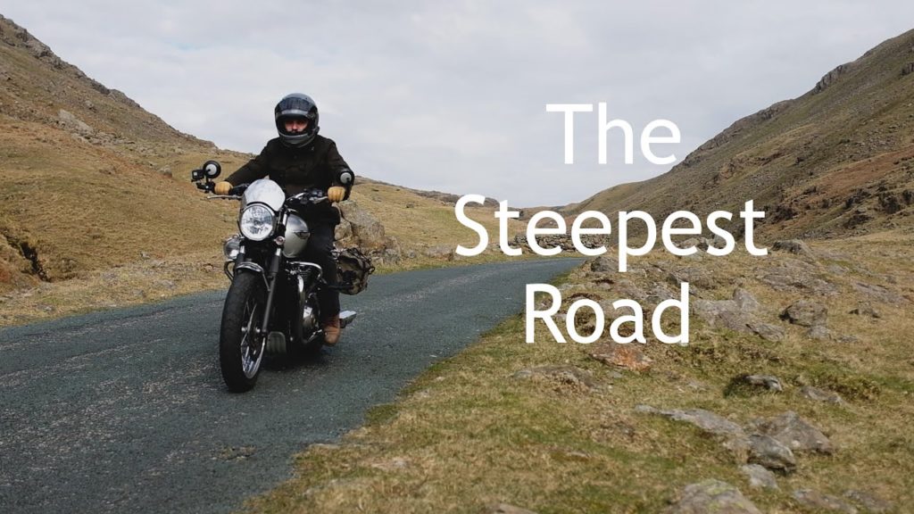 Riding a Triumph Bonneville T120 over Hardknott Pass, the steepest road in the UK. Riding a Triumph Bonneville T120 over Hardknott Pass, the steepest road in the UK.