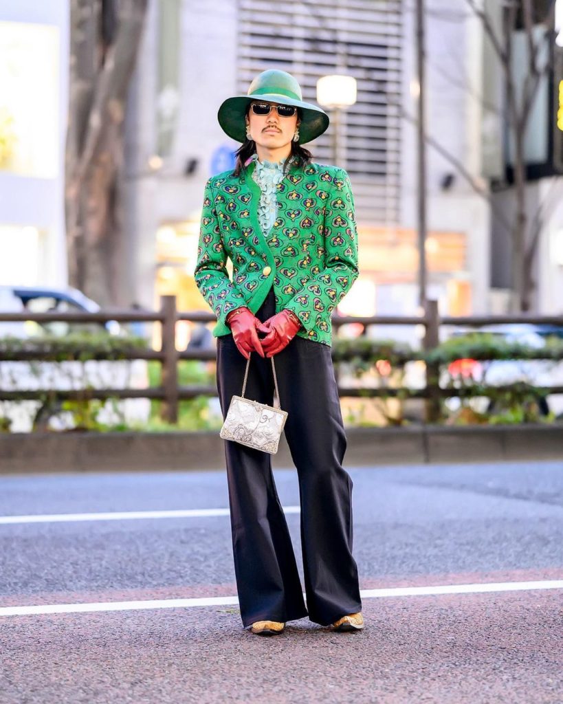 Japanese artist Hiroto (@hiroto_morisaki) on the street in Harajuku wearing an a...