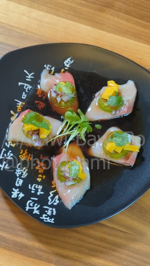 Yellowtail (hamachi) sashimi with mango, red onion, and jalapenos