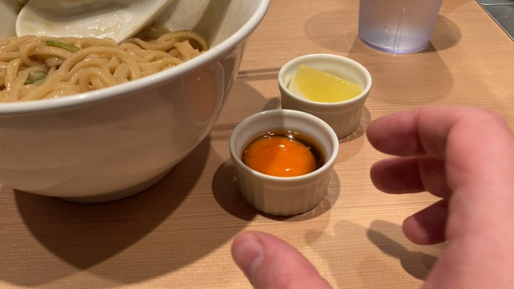 Mixing that perfect egg into mazesoba mixing style ramen at Hayashida in Tokyo