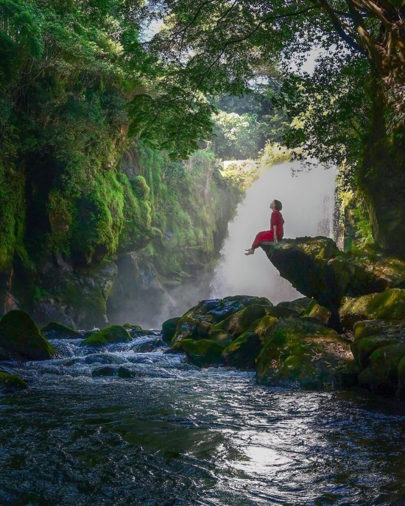 Visit Japan: Looking like a nature sprite out of a fairytale, a woman is silhouetted above th… Looking like a nature sprite out of a fairytale, a woman is silhouetted above th...