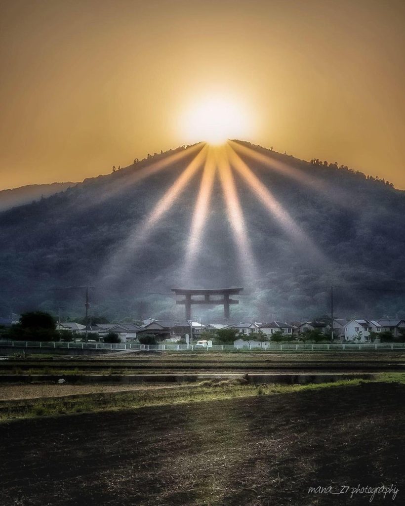 As the morning sun rises above the summit of Mt. Miwa in Nara, the stunning phen...