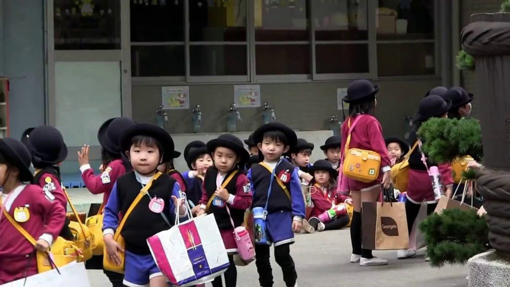 Cute School Children in Japan getting on School Bus 1881