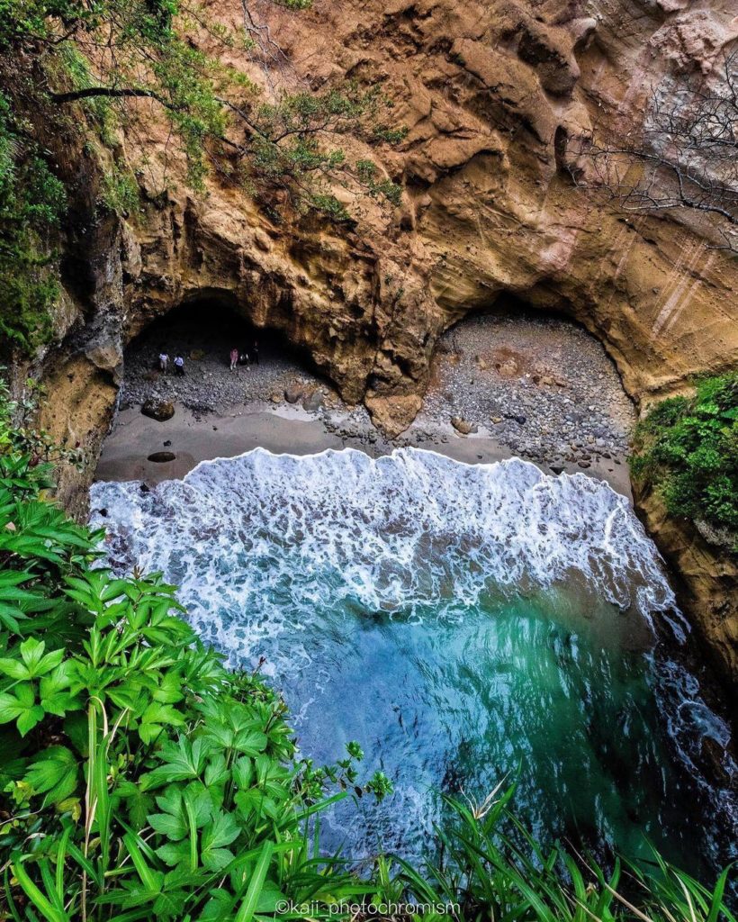 The beach at Ryugu Sea Cave forms a natural heart. Lots of friends and couples c...