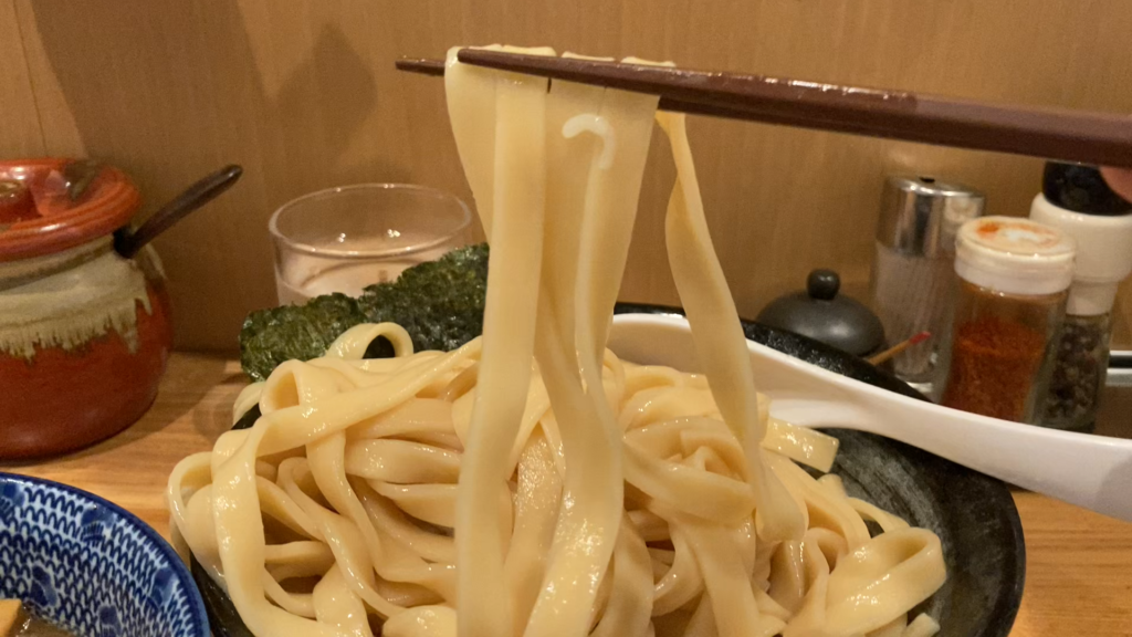 Thick and flat tsukemen noodles dipped at Hama Momiji in Yokohama