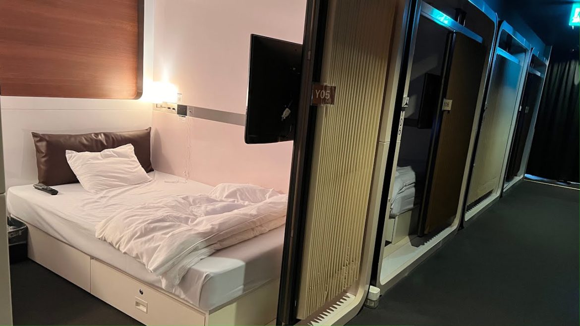 Japanese airport capsule hotel with a secret base feel| First Cabin Haneda