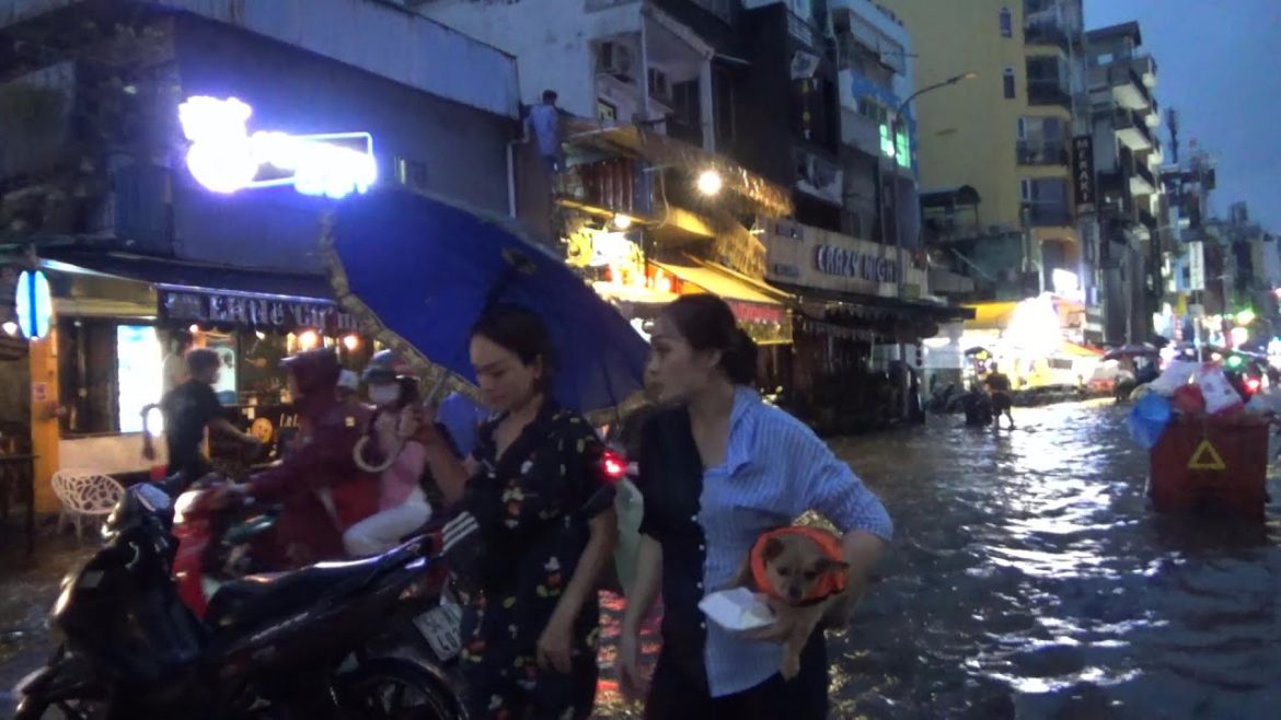 Flooding in Saigon after a crazy heavy rain at Bui Vien walking street