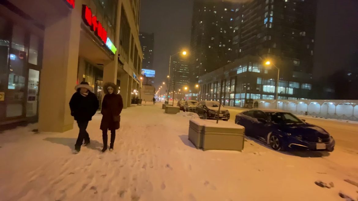 TORONTO, Canada - Night Heavy Snowy Walking Tour at Yong Street