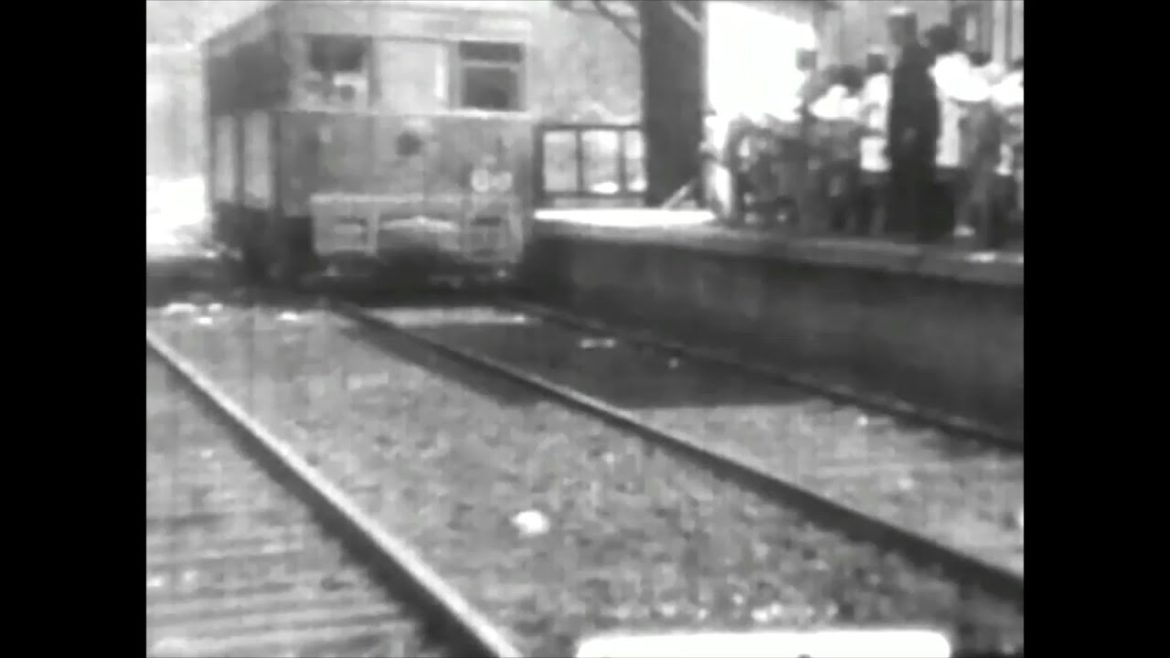 1931. Japan. A train arriving at Himeji Station. Citizens and soldiers marching in groups.precious. 1931. Japan. A train arriving at Himeji Station. Citizens and soldiers marching in groups.precious.