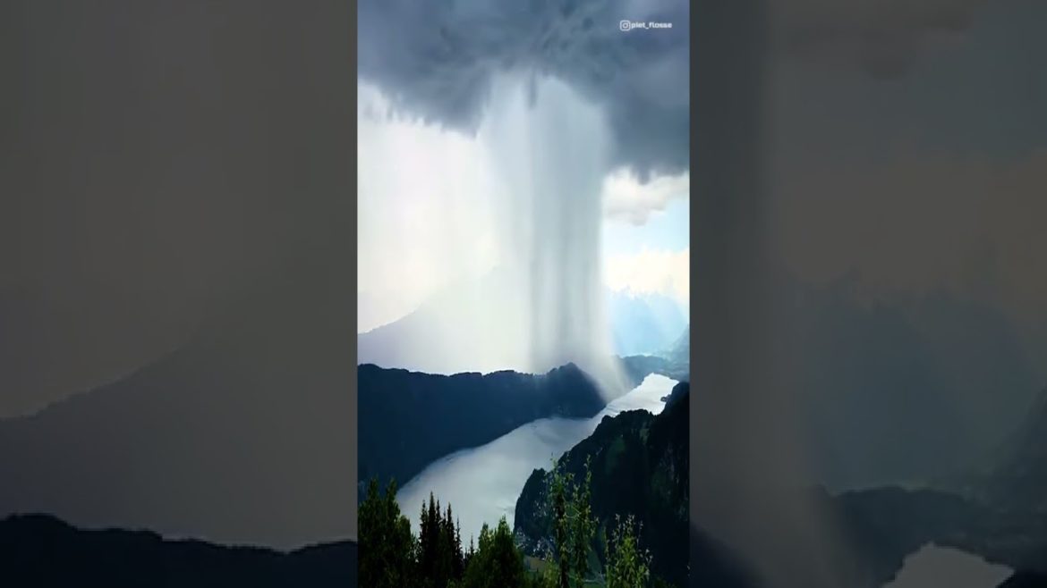 Rain pouring down on Lake Millstatt, Austria | beautiful places in the world #Shorts Rain pouring down on Lake Millstatt, Austria | beautiful places in the world #Shorts