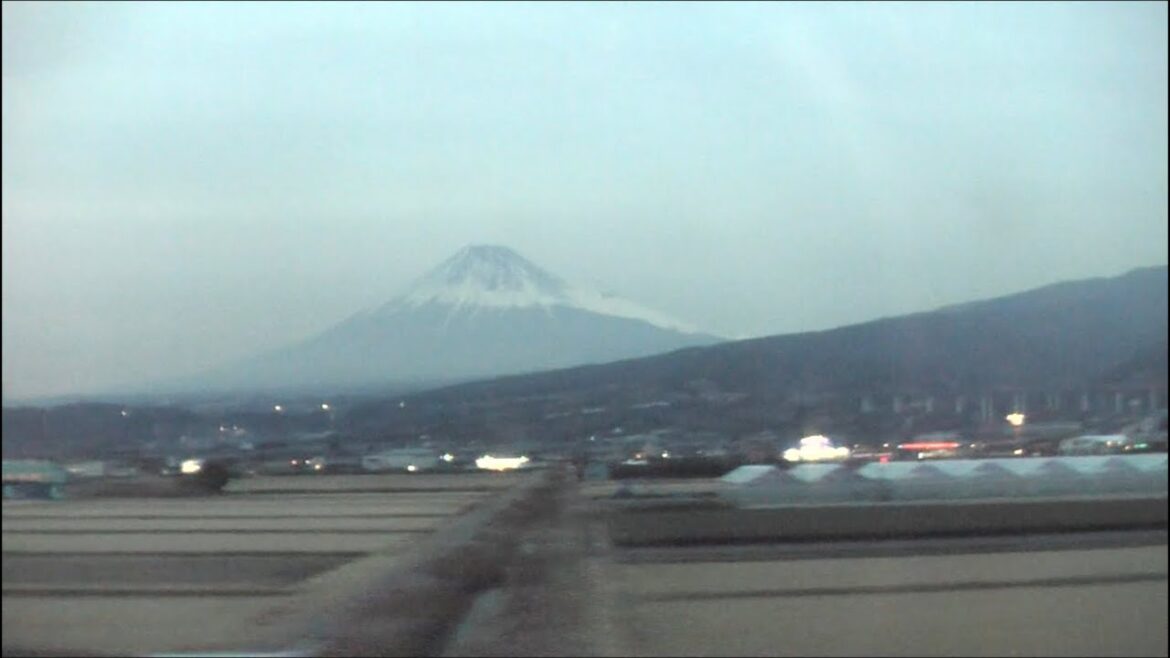 Passing Mount Fuji in a Japanese Shinkansen Bullet Train. Passing Mount Fuji in a Japanese Shinkansen Bullet Train.