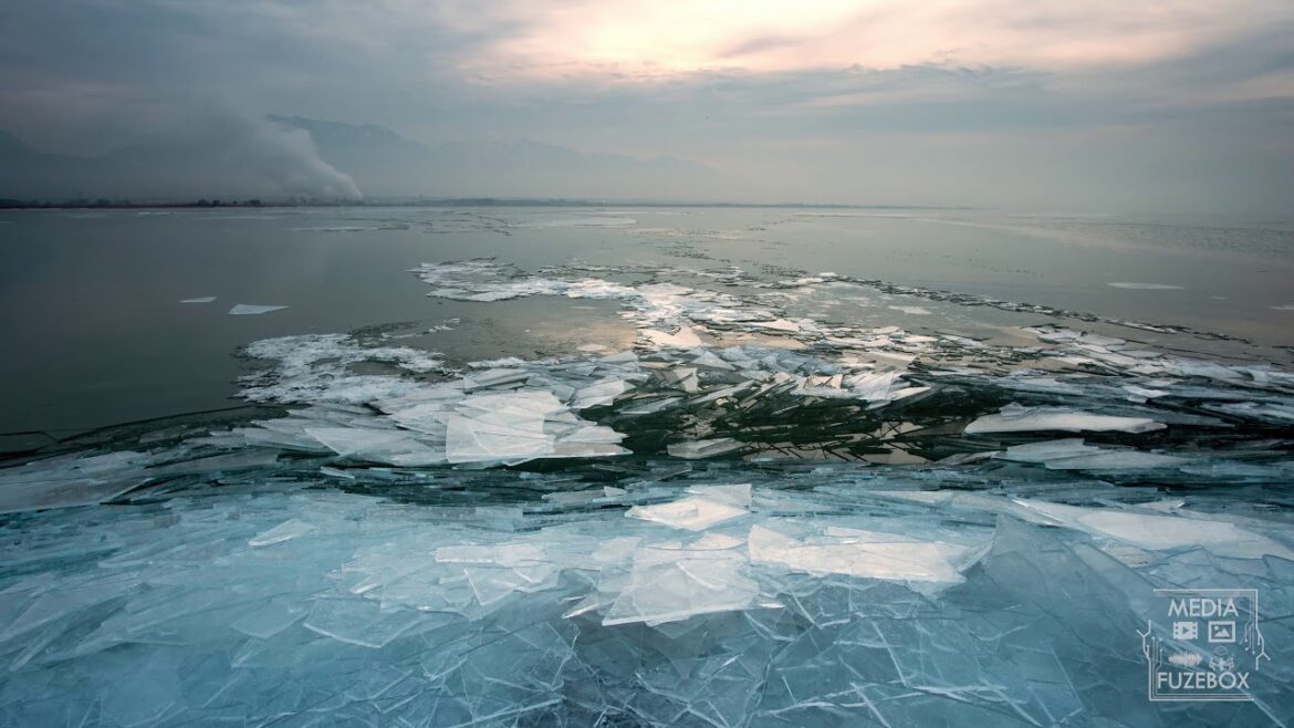Time lapse of ice piles building up on edge of lake