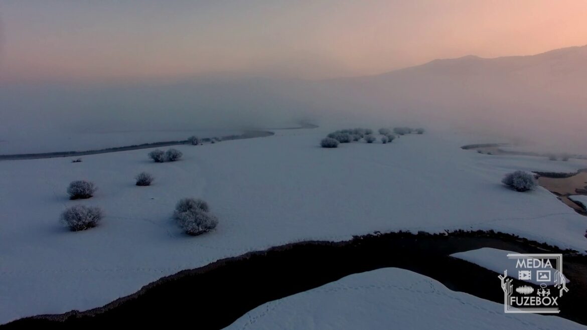 Flying though and over fog during colorful winter sunrise Flying though and over fog during colorful winter sunrise