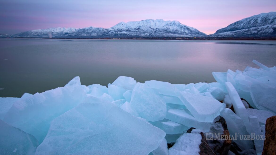 Time lapse of pink sunrise over lake with frozen ice blocks Time lapse of pink sunrise over lake with frozen ice blocks