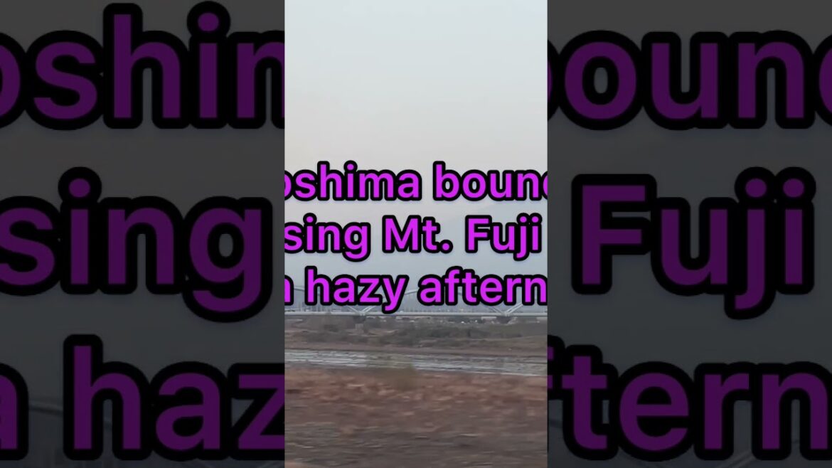 Passing Mt. Fuji on a hazy afternoon inside Nozomi shinkansen.#shorts