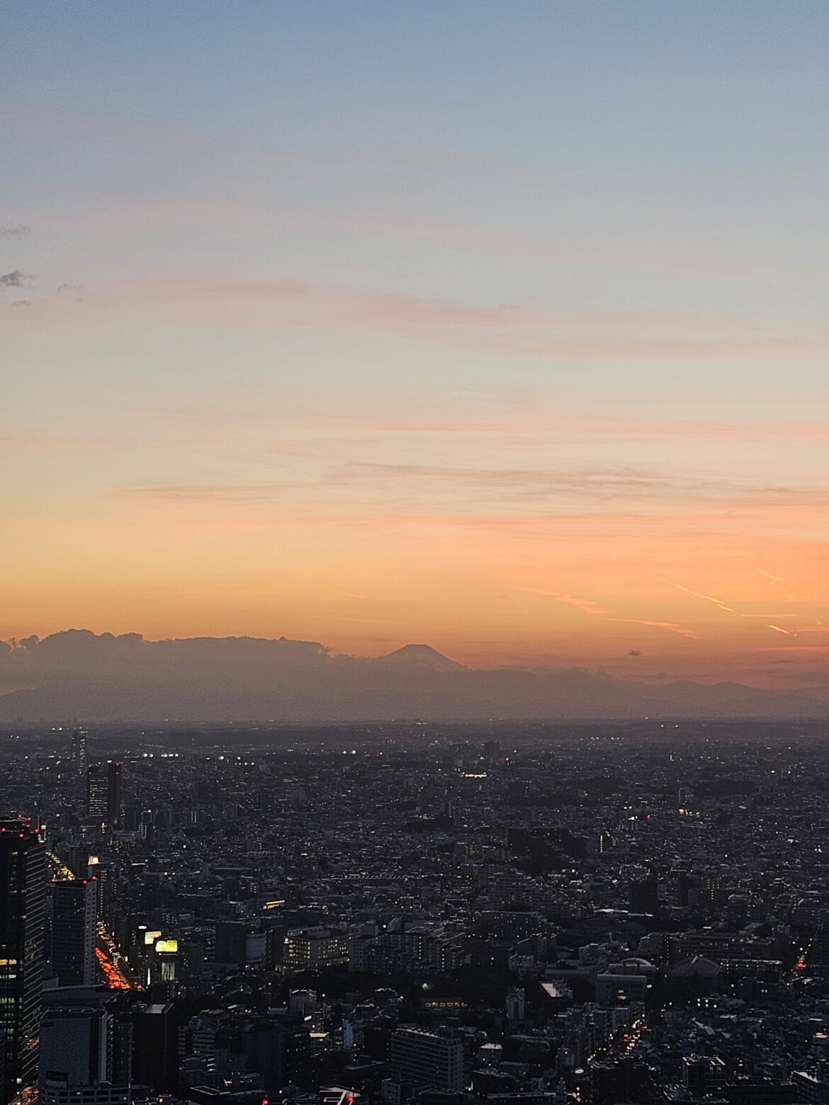 Glimpse of Mount Fuji during sunset from Shibuya Sky