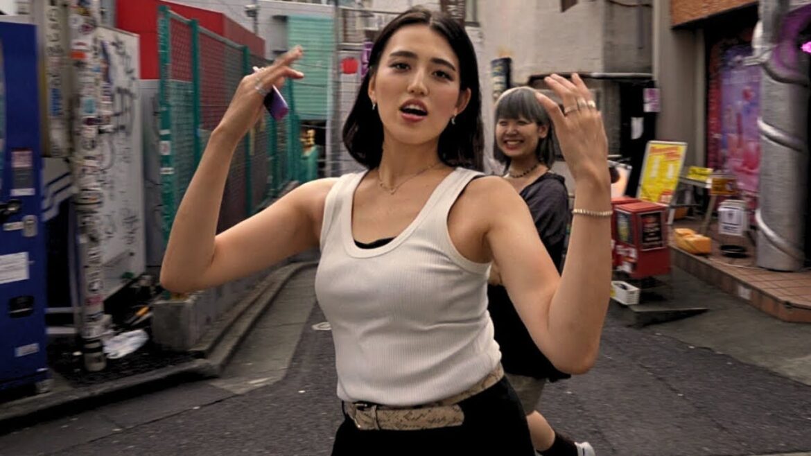 Surprised by her unexpected move in Tokyo's Romantic Town