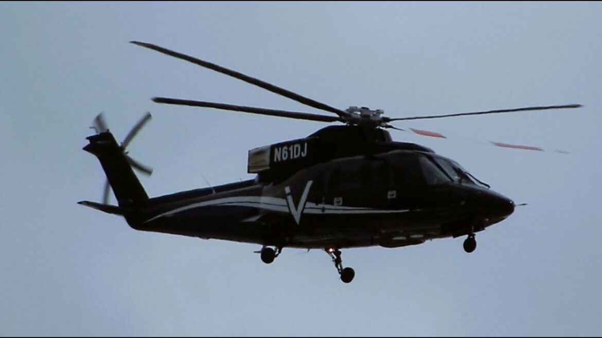 Sikorsky S-76 Hoovering (Holding) for T-6 Texan Condor Squadron to Land at Van Nuys Airport N61DJ Sikorsky S-76 Hoovering (Holding) for T-6 Texan Condor Squadron to Land at Van Nuys Airport N61DJ