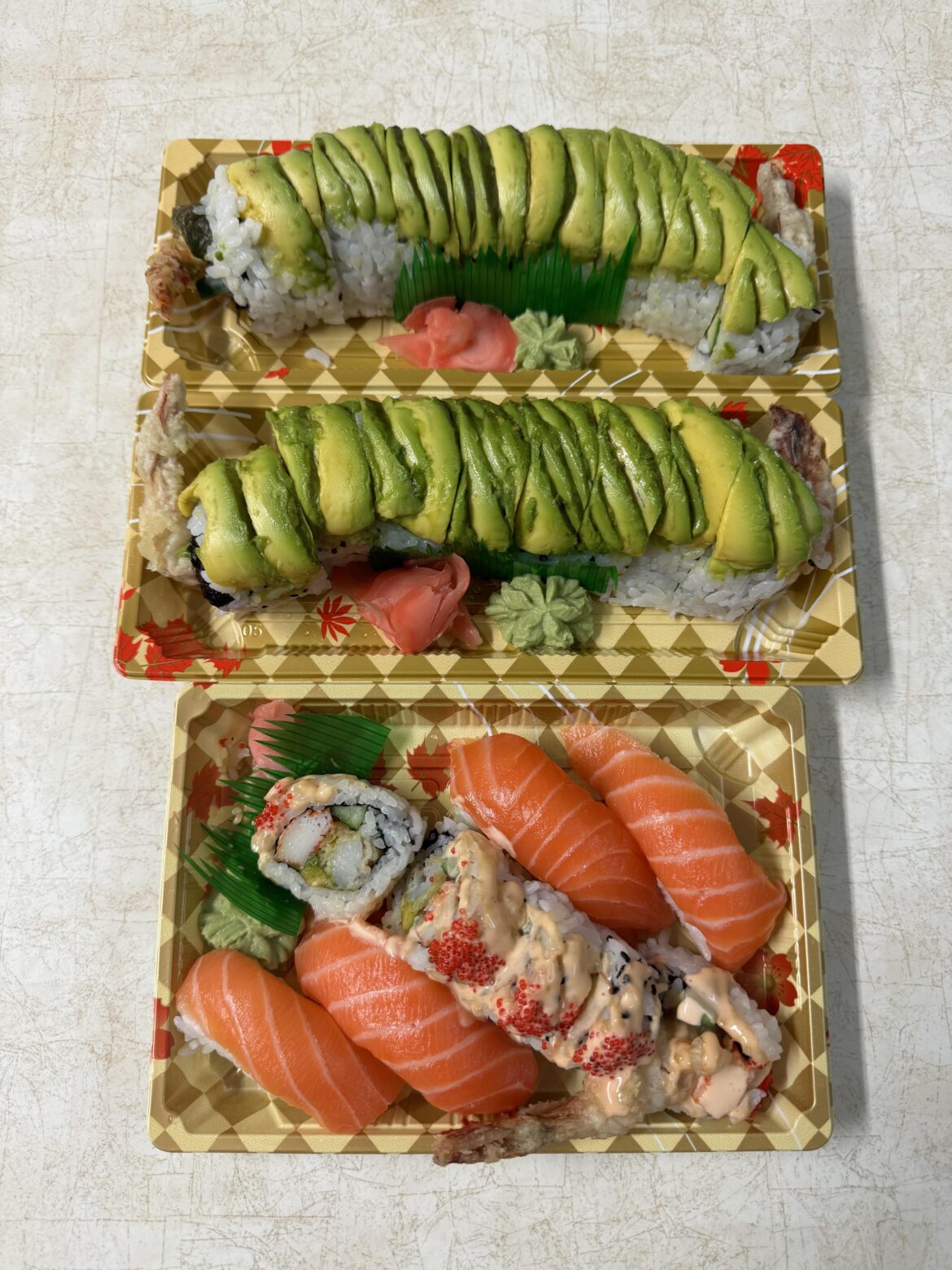 Green dragon roll, dynamic dragon roll & salmon sushi at Su&Shi Noodle Bar in Toronto