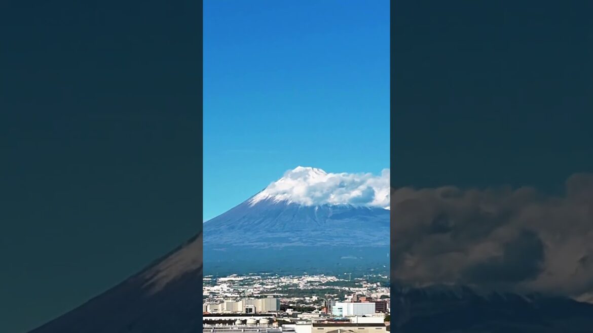 From the sky, Mount Fuji is a majestic beacon, a snow-capped crown piercing the clouds.