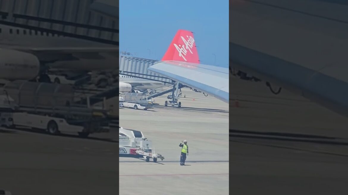 Osaka airport ground crew waving goodbye to passengers