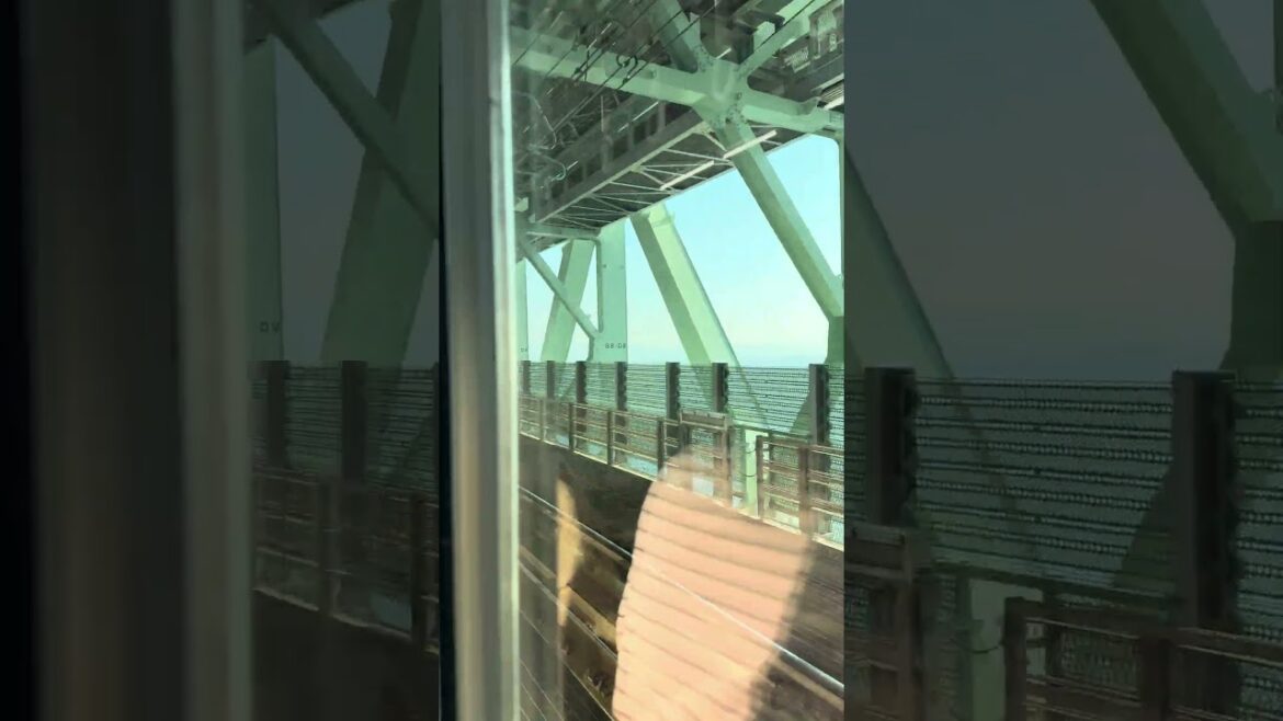 Train Crossing the Osaka Sky Gate Bridge from Kansai Airport #japan