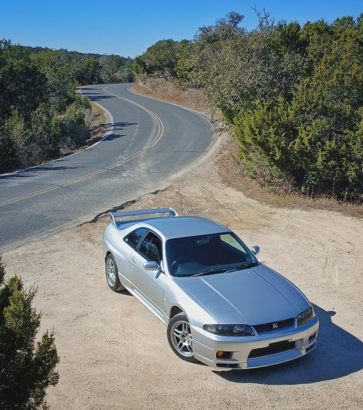 My near OEM R33 GT-R. Just a Recaro, Leask Spec Ti exhaust, nismo S Tune air panel & ARC Cooling panel. This things a riot, even in stock form.