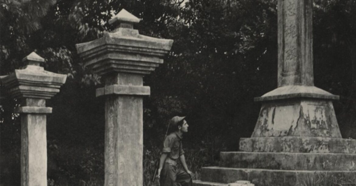 Sightseeing At Wars End: WWII Okinawa As Seen In The Bellantoni Papers Black and white photograph of a US Navy Seabee exploring a monument on Okinawa durring WWII