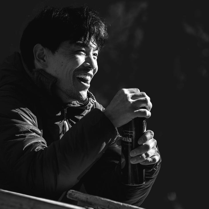 Keita Kurakami smiles in the morning sun outdoors.