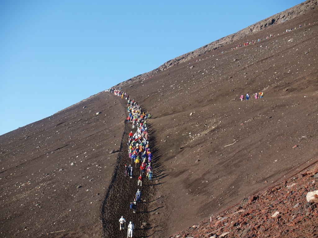 Climbers descend from the summit of Mount Fuji. Crowds have become a regular sight on the mountain in recent years. Photo: Shutterstock