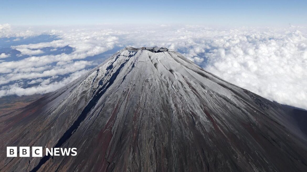 Top of Mt Fuji is covered by snow in this photo