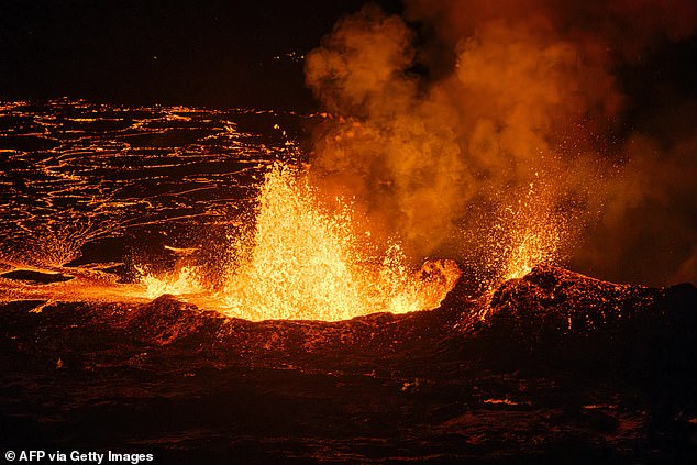 Molten lava spews from a fissure during a volcanic eruption began in Iceland, south of the capital Reykjavik, on December 19, 2023
